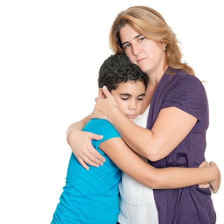 Sad mother hugging her son isolated on a white background